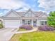 Charming single-story home with well-maintained landscaping, gray exterior, and attached garage at 101 Wins Walk, Cartersville, GA 30121