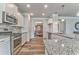 Well-equipped kitchen boasting stainless steel appliances, granite countertops, and white cabinets at 101 Wins Walk, Cartersville, GA 30121