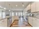 Bright, modern kitchen with stainless steel appliances, granite countertops, and wood flooring at 101 Wins Walk, Cartersville, GA 30121