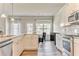 Stylish kitchen featuring granite counters, white cabinets, and an open layout connected to the dining area at 101 Wins Walk, Cartersville, GA 30121