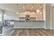 Bright kitchen with modern white cabinets, granite countertops, pendant lighting, and stainless steel appliances at 101 Wins Walk, Cartersville, GA 30121