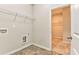Tiled laundry room with washer and dryer hookups and wire shelves at 101 Wins Walk, Cartersville, GA 30121