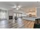 Spacious living room featuring a fireplace, wood floors, and open-concept design flowing into the kitchen at 101 Wins Walk, Cartersville, GA 30121