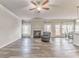 Open living room with wood floors, fireplace, natural light, and seamless flow to the dining area at 101 Wins Walk, Cartersville, GA 30121