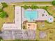 Aerial view of community pool area featuring a large pool, playground, basketball court, and shaded seating at 101 Wins Walk, Cartersville, GA 30121