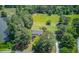 Aerial view of the property showing the house, a large backyard, and bordering trees and landscaping at 1292 Green Turf Dr, Snellville, GA 30078