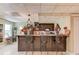 Finished basement bar featuring granite countertops, bar stools, and cabinetry at 1292 Green Turf Dr, Snellville, GA 30078
