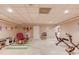 Finished basement area with versatile spaces for recreation, including tile flooring and bright lighting at 1292 Green Turf Dr, Snellville, GA 30078