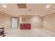 Spacious basement area ready for customization, featuring tile flooring and great natural light at 1292 Green Turf Dr, Snellville, GA 30078