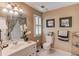 Bathroom with traditional sink, framed art, and toilet with a towel rack at 1292 Green Turf Dr, Snellville, GA 30078