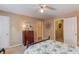 Bedroom with bed, wood dresser, and doors to other rooms at 1292 Green Turf Dr, Snellville, GA 30078