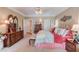 Spacious bedroom with light carpet, ceiling fan, and dresser with decor at 1292 Green Turf Dr, Snellville, GA 30078