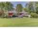 Beautiful home with a well-maintained lawn, patio, and serene surroundings, perfect for outdoor enjoyment at 1292 Green Turf Dr, Snellville, GA 30078
