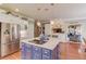 Kitchen with center island, stainless appliances, and adjoining living space at 1292 Green Turf Dr, Snellville, GA 30078