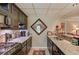 Kitchenette featuring granite countertops, stainless steel appliances, and dark cabinetry at 1292 Green Turf Dr, Snellville, GA 30078