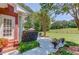 Serene backyard patio with lush landscaping and outdoor seating area perfect for relaxation or entertaining guests at 1292 Green Turf Dr, Snellville, GA 30078