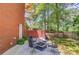 Cozy patio area with outdoor chairs surrounding a fire pit, perfect for gathering with friends and Gathering at 1292 Green Turf Dr, Snellville, GA 30078