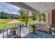 Charming covered porch with outdoor seating, scenic views, and a serene atmosphere at 1292 Green Turf Dr, Snellville, GA 30078