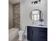 Chic bathroom with walk-in shower, modern vanity, marble countertop, and decorative tile at 1962 8Th St, Chamblee, GA 30341
