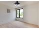 Bright bedroom with large window, hardwood floors, ceiling fan and neutral paint at 1962 8Th St, Chamblee, GA 30341