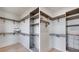 Dual walk-in closets with shelving and pull-out wire basket drawers at 1962 8Th St, Chamblee, GA 30341