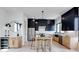 Bright, modern kitchen featuring two-tone cabinets, a marble island, stainless steel appliances, and bar stool seating at 1962 8Th St, Chamblee, GA 30341
