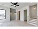 Bright living room space featuring hardwood floors, black framed windows, modern lighting, and a staircase at 1962 8Th St, Chamblee, GA 30341