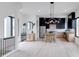 Open-concept living and kitchen area with hardwood floors, modern lighting, and designer cabinetry at 1962 8Th St, Chamblee, GA 30341