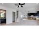 Bright open-concept living space features light wood floors, a modern kitchen, and half bathroom at 1962 8Th St, Chamblee, GA 30341