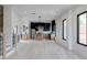 Bright open-concept living and kitchen space with hardwood floors, modern lighting, and lots of windows at 1962 8Th St, Chamblee, GA 30341