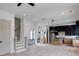 Bright, open-concept living space with modern kitchen, light wood floors, and staircase access at 1962 8Th St, Chamblee, GA 30341