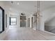 Bright open living room featuring hardwood floors, modern lighting, black framed windows, and a staircase at 1962 8Th St, Chamblee, GA 30341