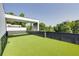 An expansive roof deck featuring lush green artificial turf and a covered outdoor seating area, perfect for relaxation and entertainment at 1962 8Th St, Chamblee, GA 30341