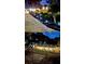 Scenic backyard at night with landscape lighting and patio; cozy ambiance at 2139 Cedarbrook Court South East, Atlanta, GA 30316