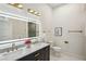 Elegant bathroom with double sinks, granite countertops, and modern lighting at 2139 Cedarbrook Court South East, Atlanta, GA 30316