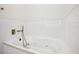 Relaxing bathtub with textured tile and modern fixtures at 2139 Cedarbrook Court South East, Atlanta, GA 30316