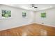 Sunlit bedroom with hardwood floors and windows overlooking the yard at 2139 Cedarbrook Court South East, Atlanta, GA 30316