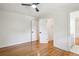 Bright bedroom with hardwood floors and neutral walls, showcasing modern doors and a ceiling fan at 2139 Cedarbrook Court South East, Atlanta, GA 30316