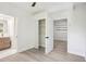 Bright bedroom featuring hardwood-look floors, neutral walls and a doorway to a bathroom and closet at 2139 Cedarbrook Court South East, Atlanta, GA 30316