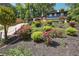 Beautiful two-story home with a well-landscaped front yard featuring colorful flowers, trees, and shrubbery at 2139 Cedarbrook Court South East, Atlanta, GA 30316