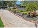 Charming two-story home with a long driveway and meticulously landscaped front yard, creating an inviting curb appeal at 2139 Cedarbrook Court South East, Atlanta, GA 30316
