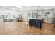 Open kitchen featuring island with seating, stainless appliances, and hardwood floors at 2139 Cedarbrook Court South East, Atlanta, GA 30316