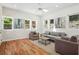 Bright living room boasts a ceiling fan, hardwood floors and comfortable seating at 2139 Cedarbrook Court South East, Atlanta, GA 30316