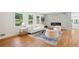 Cozy living room boasts hardwood floors, a modern fireplace, and an inviting atmosphere for relaxation and gatherings at 2139 Cedarbrook Court South East, Atlanta, GA 30316