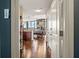 Hallway view leads to a modern living space, bathed in natural light with sleek hardwood floors at 270 17Th Nw St # 1113, Atlanta, GA 30363