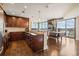 Modern kitchen featuring dark cabinets, hardwood floors, and an open concept design with city views at 270 17Th Nw St # 1113, Atlanta, GA 30363