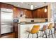Beautiful kitchen with stainless steel appliances, granite countertops, and dark wood cabinets at 270 17Th Nw St # 1113, Atlanta, GA 30363