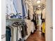 Organized walk-in closet with ample storage and hardwood floors at 270 17Th Nw St # 1113, Atlanta, GA 30363
