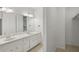 Bright bathroom features double vanity with marble countertop, large mirror, and walk-in closet at 49 Willow Gln, Atlanta, GA 30342