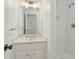 Bright bathroom with a marble countertop, white vanity, and a walk-in shower at 49 Willow Gln, Atlanta, GA 30342